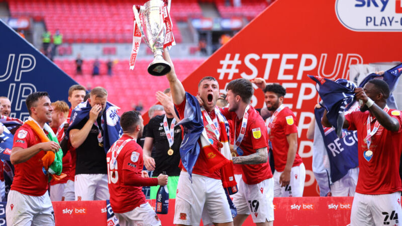 La National League sospende Morecambe fino a metà agosto mentre il club colpito da crisi rimane sull’orlo: rapporto